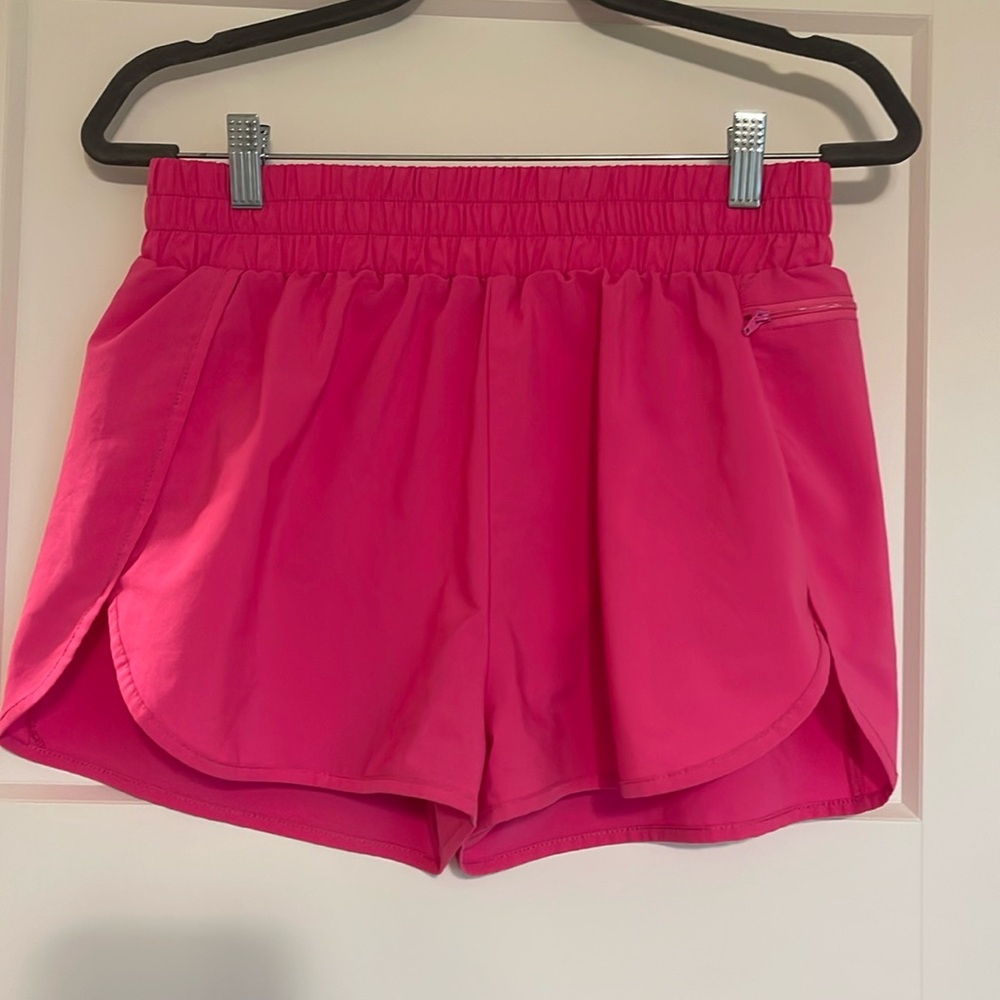 pink running shorts, size medium